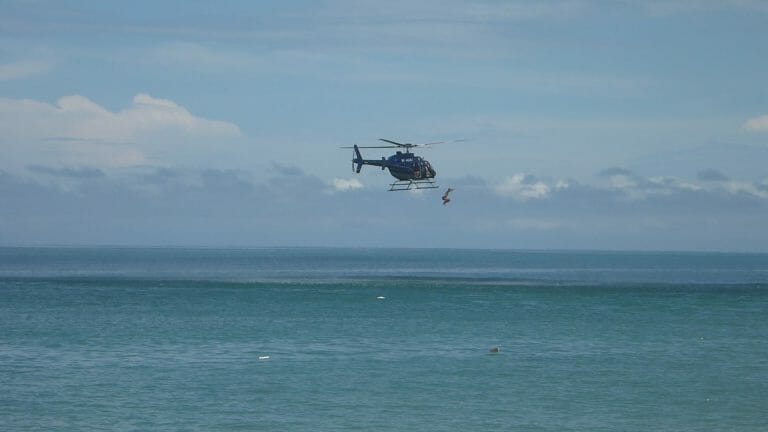 Big announcement: Special Expeditions planned for 2024 16 A private helicopter soaring over the ocean.