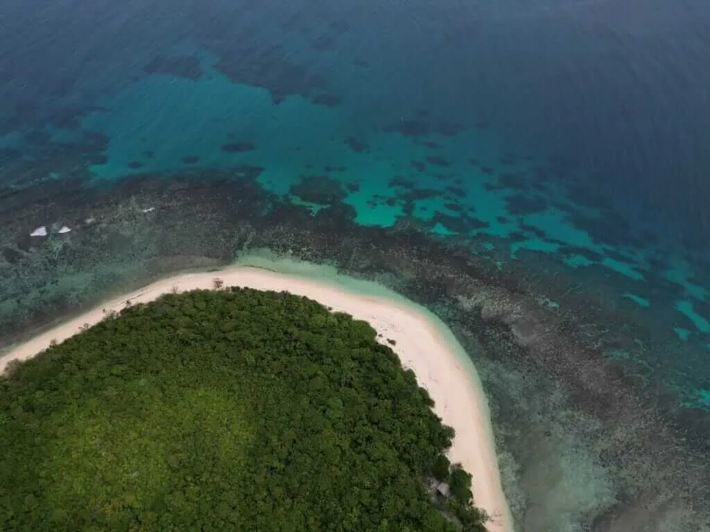 An aerial view of an island in the ocean.
