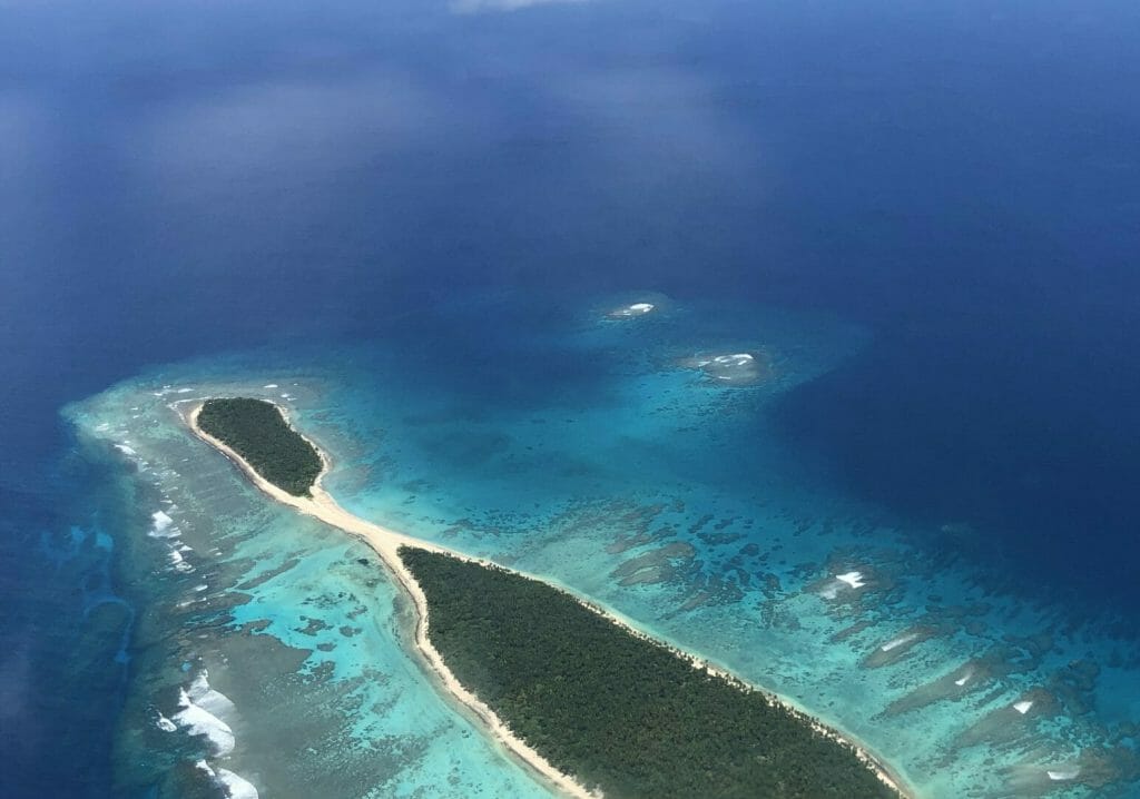 An aerial view of an island in the ocean.