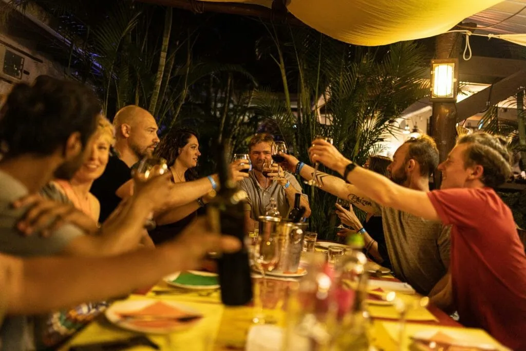 A group of people toasting at a dinner table in Panama.