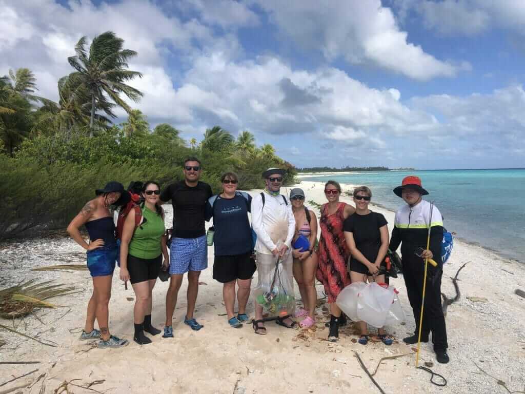 People collecting rubbish on the beach