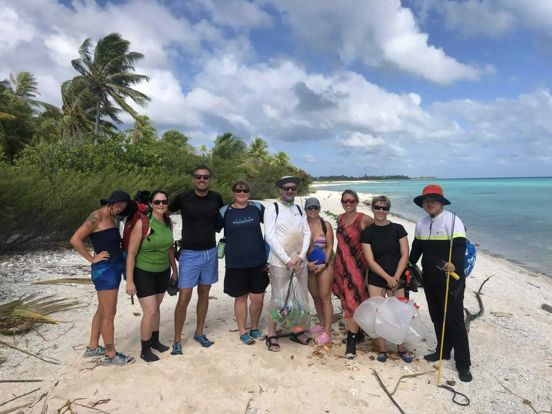 People collecting rubbish on the beach