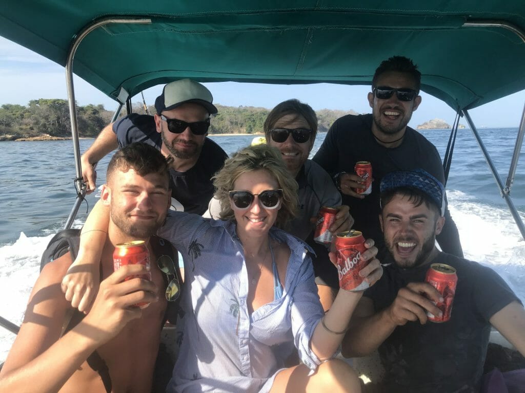 Rescue after survival phase. Smiling people on a boat
