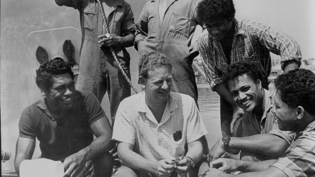 The reality as Skipper Peter Warner is pictured with (left to right) Stephen, Kolo Luke, David, John and Mano after hiring the rescued boys in 1968 (Image: Fairfax Media via Getty Images)