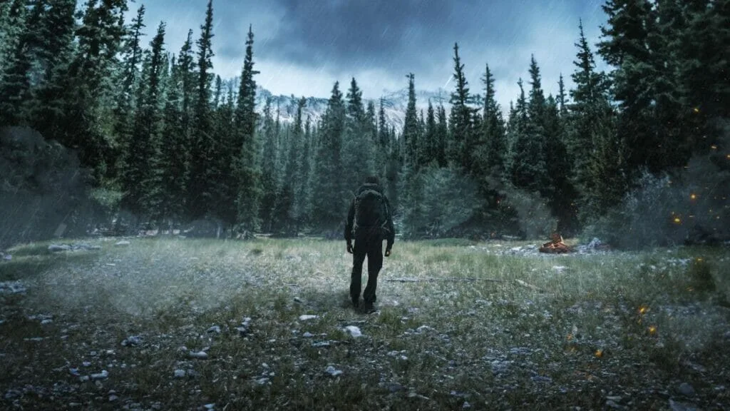 Alone in a forest clearing, a lone figure walks towards a campfire under a stormy sky. Alone UK Gear List.