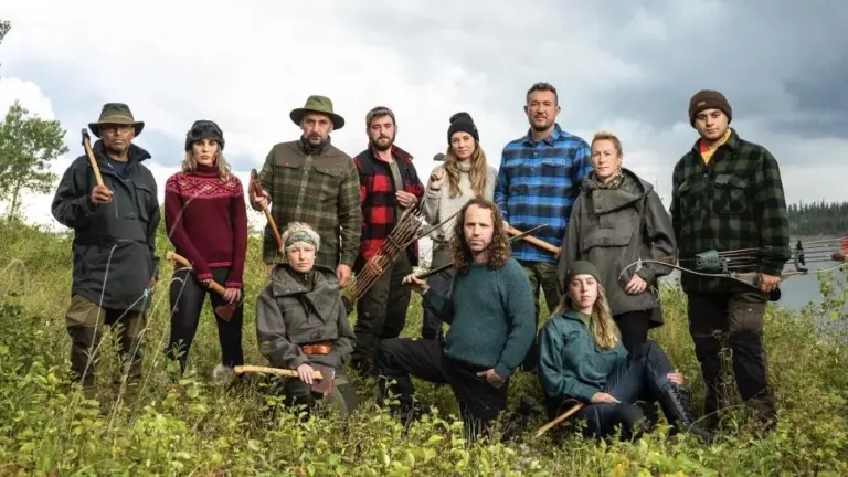 Alone UK contestants with survival gear outdoors.