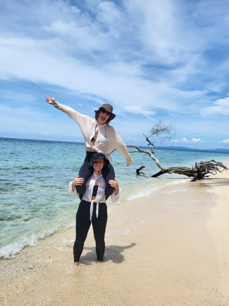two women on beach in Indonesia