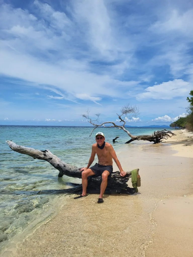 Man smiling on beach in Indonesia