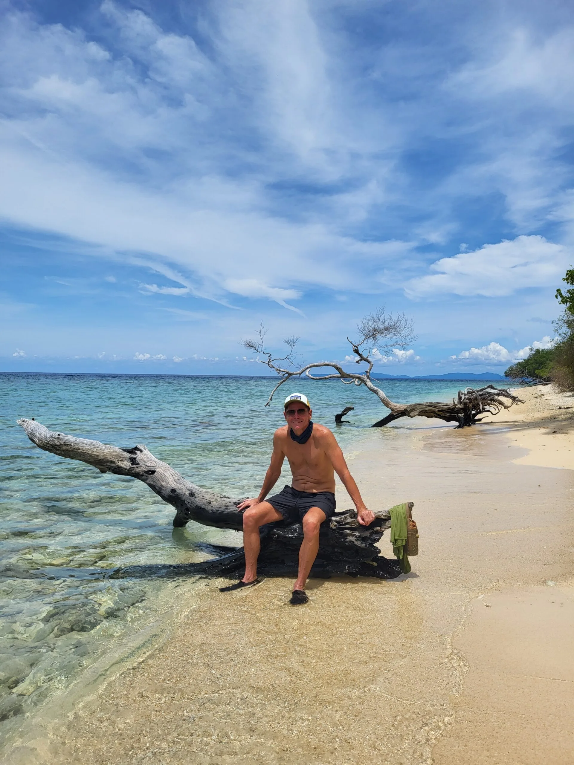 Man smiling on beach in Indonesia
