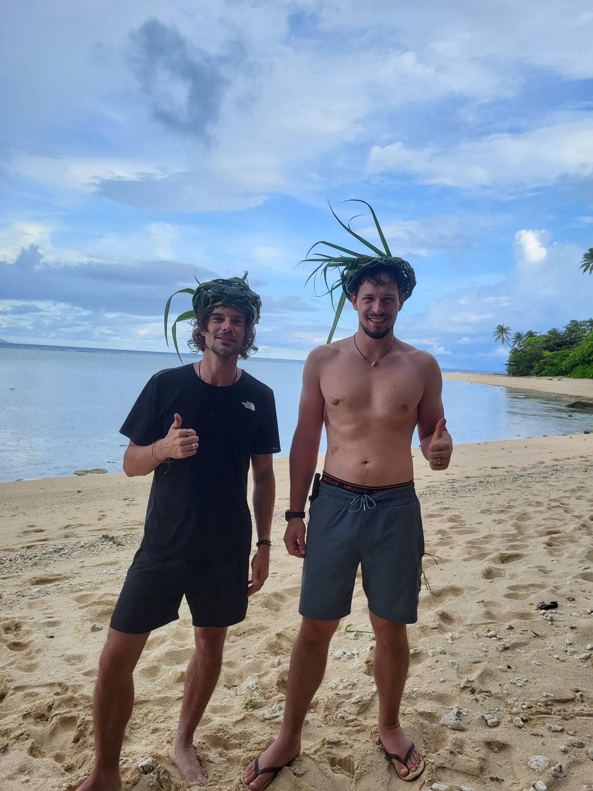 Men with woven hats on beach Indonesia