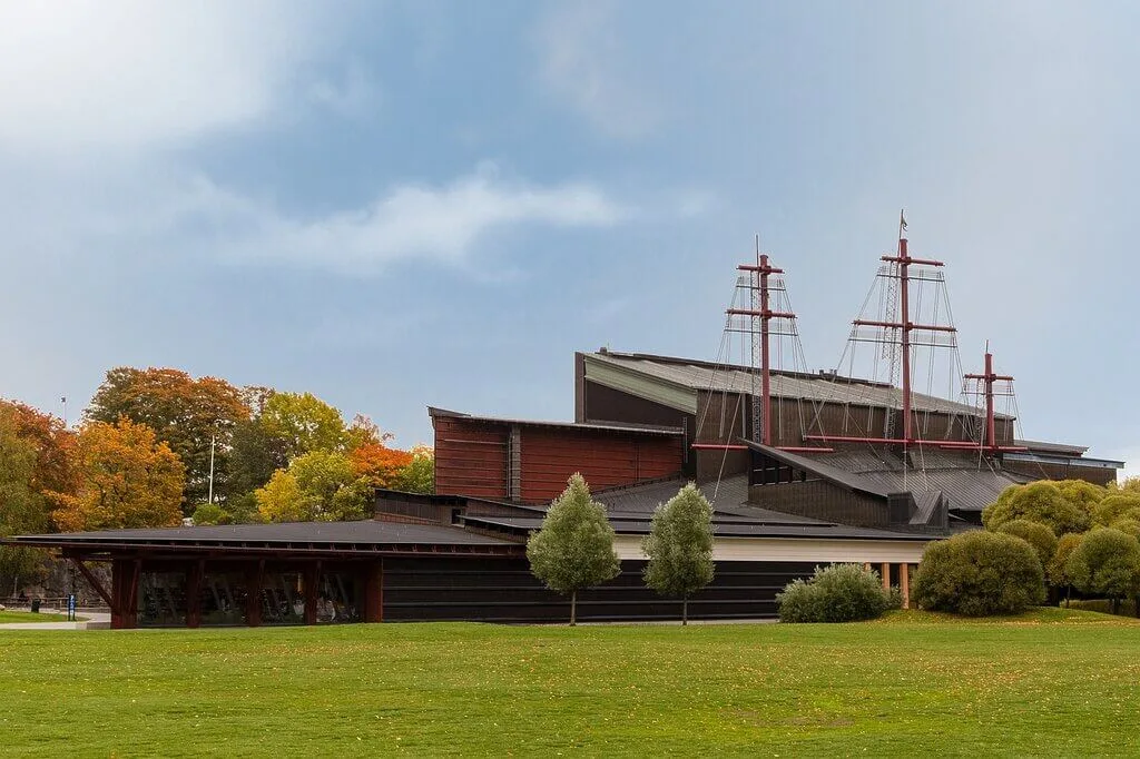 Exterior of the Vasa Museum in Stockholm, Sweden, with ship masts visible.