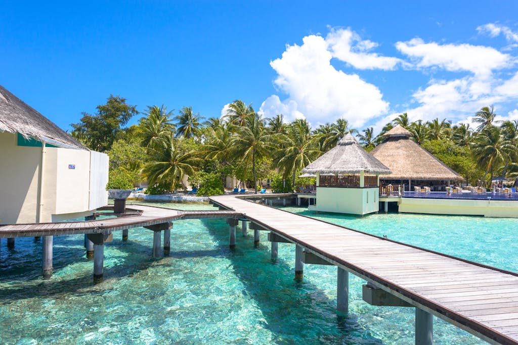 The Maldives Beyond Honeymoons. Adventure Meets Paradise 7 Explore tropical paradise with stunning overwater bungalows and crystal-clear waters in the Maldives.