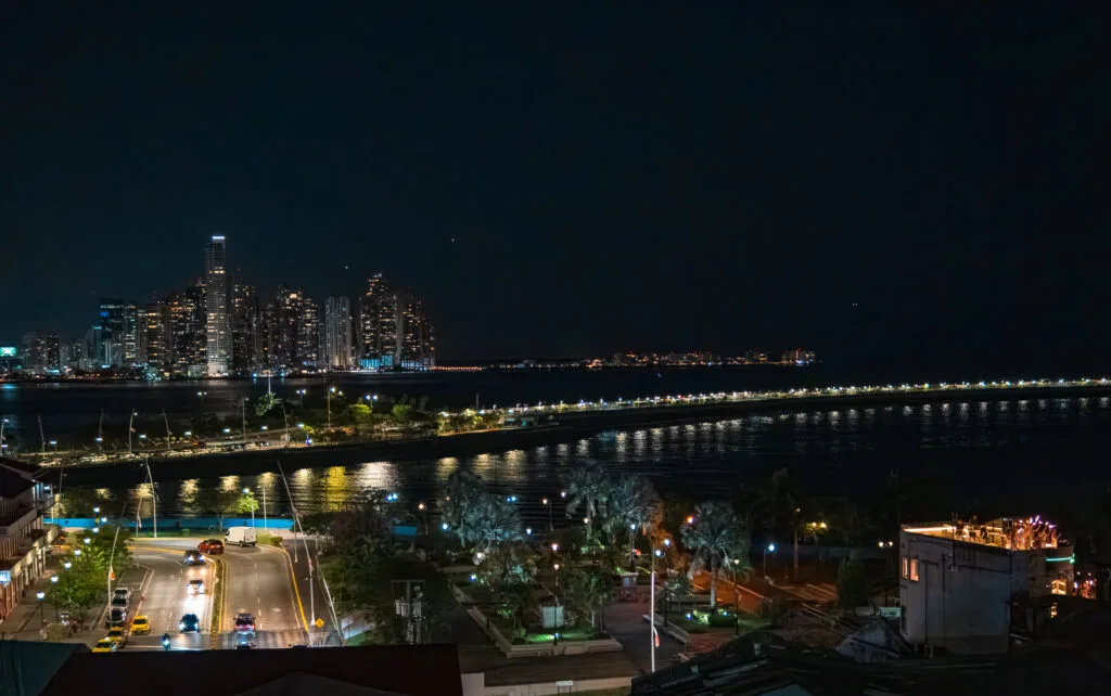Night view of Panama City skyline and Cinta Costera. Reflects the calm without technology.