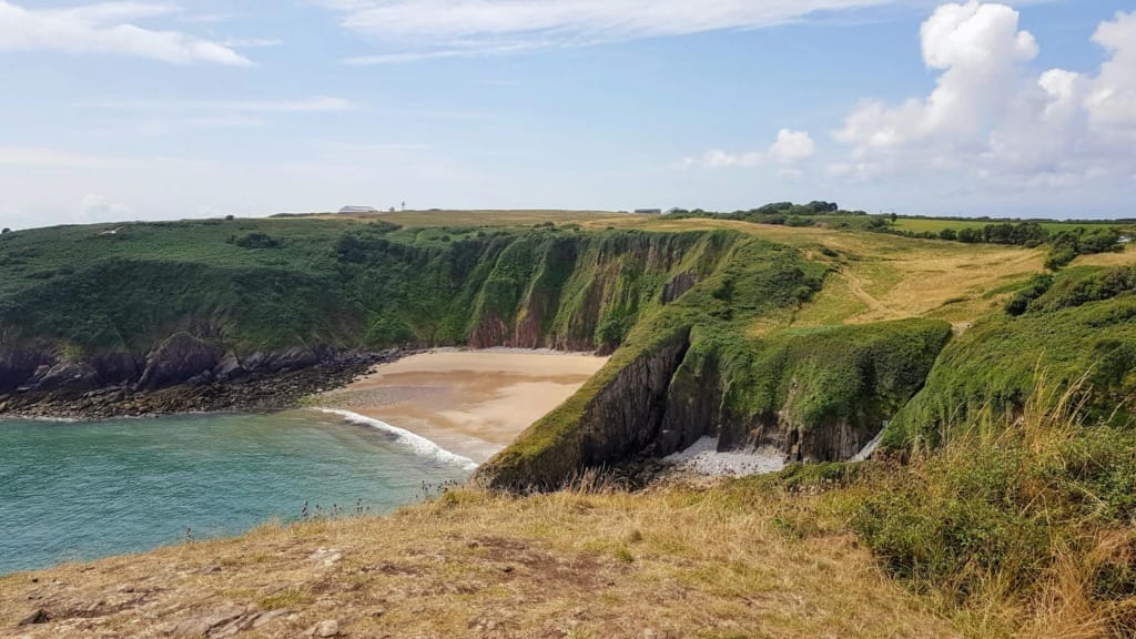How Nature Supercharges Personal Growth 7 Beautiful coastal landscape of Manorbier Beach, Wales with cliffs and ocean view.