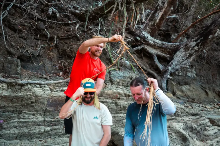 Furveying a rocky shoreline for survival resources on a desert island.