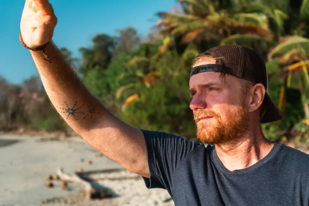 Survivalist on desert island showcasing resilience and outdoor skills for island survival.