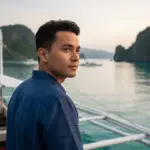 Desert Island Survival Adventure in the Philippines 37 Secluded tropical island scene with a man overlooking the ocean, emphasizing survival skills and island exploration.