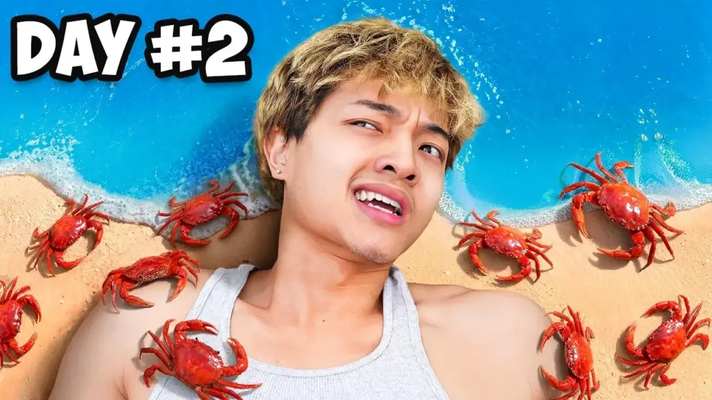 Man surrounded by crabs on beach, "Day #2" text overlay.